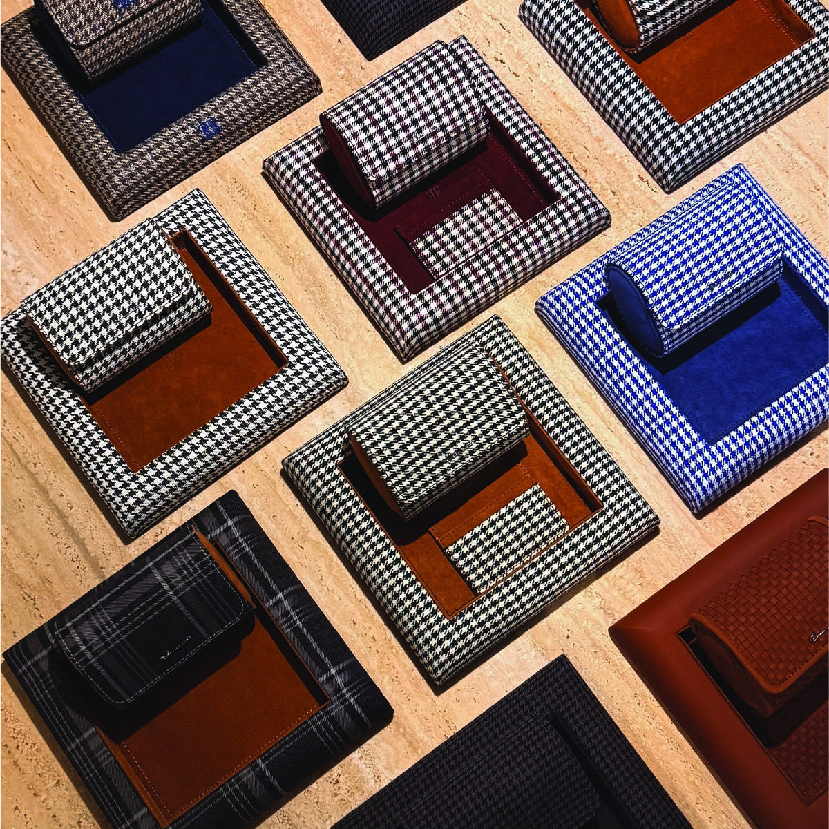 Elemento card sleeves and valet trays in houndstooth, herringbone and tartan on travertine